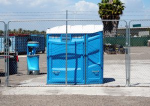 wheelchair accessible porta potty on a construction yard